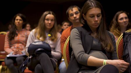 France - Paris, 11.15.2019: full auditorium of people, spectators watch performance listening to the speaker. Art. Many people in the hall at the boring conference.のeditorial素材