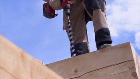 Metal spiral drill for making holes in logs when assembling a wooden frame and building a house....