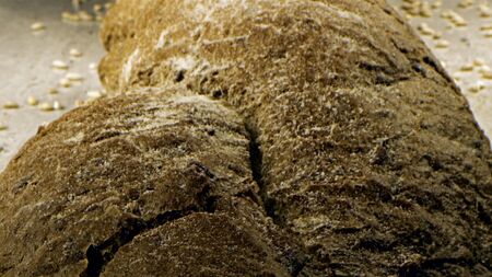Close-up of traditional bread. Stock footage. Fresh homemade bread made according to old traditions
