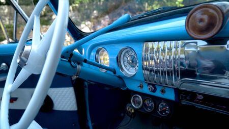 Vintage retro car interior. Action. Beautiful design of a blue retro car. Interior of the car.