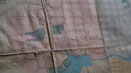 Close-up of outline map details. Stock footage. Details of marked area on contour map. Old contour map with markers and terrain details.の写真素材