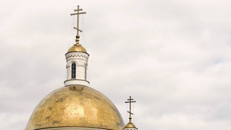 Beautiful architectural facade of the Christian Church with Golden domes. Stock footage. White walls...