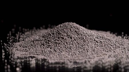 Close up of black pepper pile lying on the black surface and on a black background, cooking food and spices concept. Stock footage. Black pepper corns, small grains.の写真素材