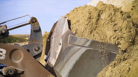 Close-up of excavator digging up ground. Stock footage. Digging operations using excavator to clear...