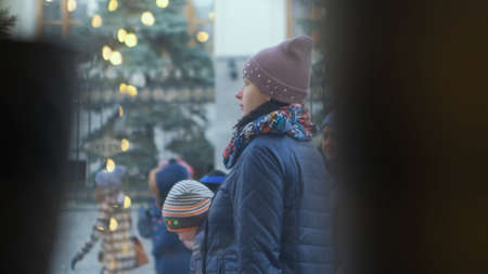 Russia - Moscow, 07.09.2019: crowd of people walking in the street. View from behind the cafe window on people passing by during the day of Moscow city.のeditorial素材