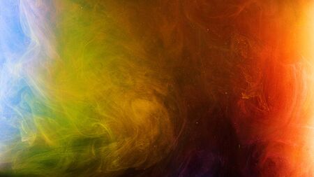 Colorful smoky flow of mixed colors in water. Stock footage. Diffusion of multicolored ink with...