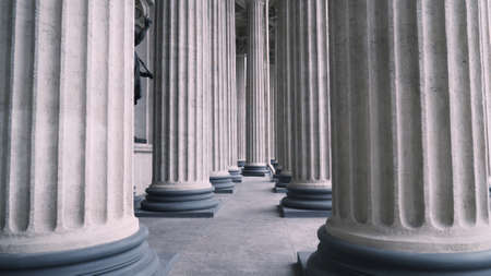 Colonnade with corinthian orders of ancient building. Action. Bottom view of beautiful white columns of old building. Colonnade of Kazan Cathedral in Saint Petersburgの写真素材