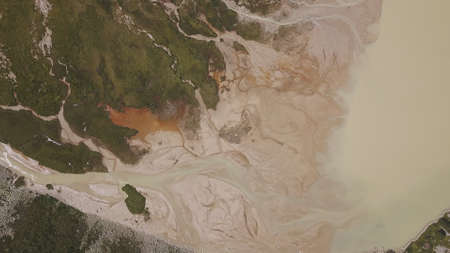 Aerial view of the lime quarry on the sunny summer morning. Clip. Top view of picturesque abandoned...