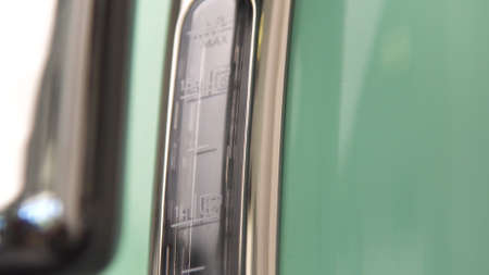 Close up of new coffee machine details. Household utensils. New polished coffee machine of mint...