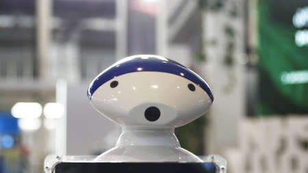 Close up of the moving humanoid robot with a camera on his head. Media. New technological robot...
