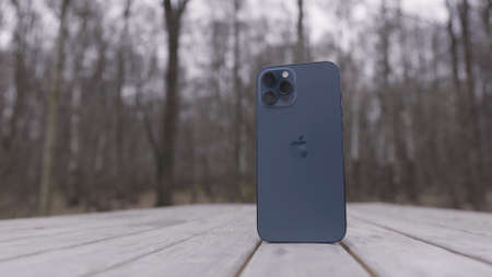 Tokyo, Japan - 11.20.2020: Close up of a new Apple Iphone 12 Pro Max in pacific blue color. Action....