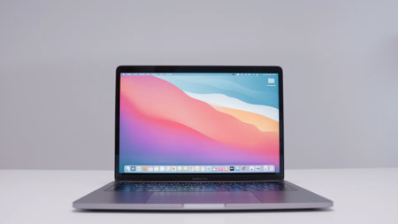 RUSSIA, MOSCOW-DECEMBER, 2020: New Macbook. Action. New generation of Macbooks from Apple with improved performance and perfect design. Bright screen of new Macbook on isolated backgroundのeditorial素材