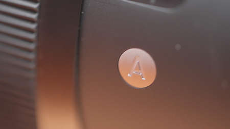 Close up of digital camera lens details. Action. New plastic camera body, concept of photo and video...