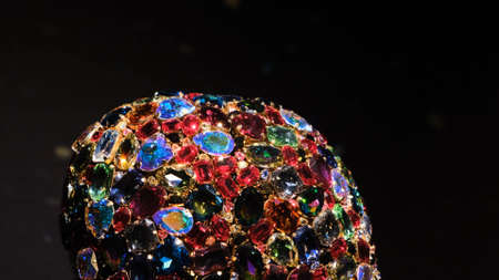 Lot of colorful crystals on isolated background. Concept. Close-up of multicolored shiny crystals combined into one shape. Museum specimen of variety of expensive stones in one itemの写真素材