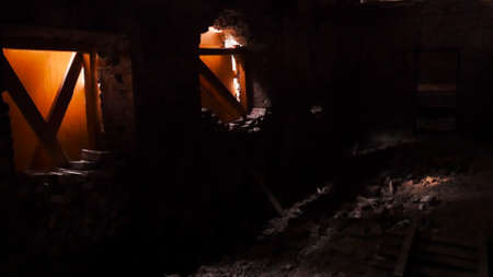 Inside old ruined house. Stock footage. Dark interior of abandoned brick house. Boarded up windows inside abandoned houseの写真素材