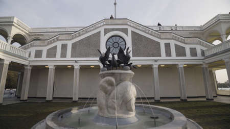 Details of North River Terminal white building, Moscow, Russia. Action. Beautiful architectural ensemble with a fountain and colonnade of a railway station.の写真素材