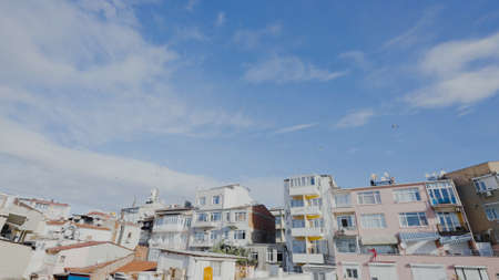 Residential buildings in southern style. Action. Street with beautiful residential buildings on sunny day. Architecture of residential buildings in southern countryの写真素材