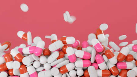 Colorful pills fall on isolated background. Animation. Colorful medicinal pills fall in pile on colored background. Medicines, pills, and treatment pillsの写真素材