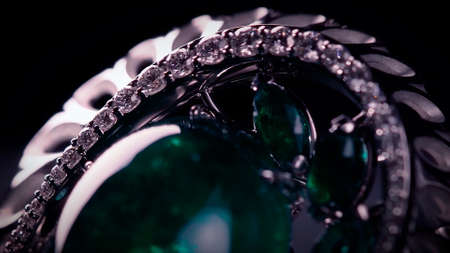 Brooch in with stones on a black rotating stand. Video. Close up of jewelry made of white gold,...