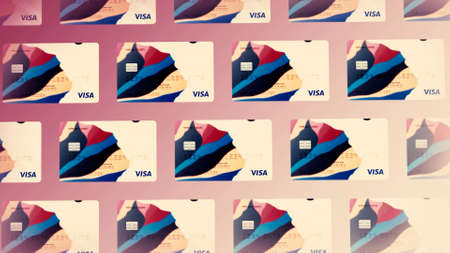 Abstract stack of Visa credit and debit cards on colorful background. Motion. Rows of bank cards illustrating new design, concept of money and online payment.の写真素材