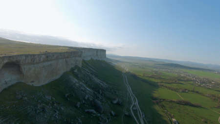 RUSSIA, CRIMEA - AUGUST 20, 2021: Top view of beautiful rock with balloon. Shot. Landscape with rock...