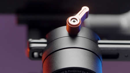 Portable video camera or smartphone electronic stabilizing system details. Action. Extreme close up of professional equipment for shooting isolated on purple wall background.の写真素材