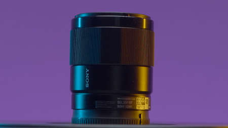RUSSIA, MOSCOW - MAY 5, 2021: New professional camera lens on isolated background. Action. New...