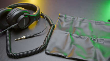 RUSSIA, MOSCOW - MAY 5, 2021: New headphones on table. Action. New model of headphones with packaging from Shure on isolated background. Commercials for new headphones with noise reductionのeditorial素材