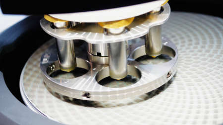 Close up of metal tubes of biochemical analyzer. HDR. Examination of medical samples at the...