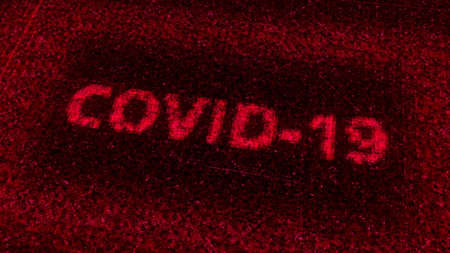 Abstract red computer screen with the digital word covid 19. Animation. Concept of medicine and high tech technologies.の写真素材