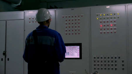 Labor force. Clip. A man in a factory does something for work aimed at production.