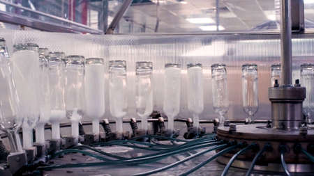 Complex for the production of glass bottles and drinks. Clip. Mechanical machine in a factory with...