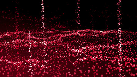 Red and orange background.Motion.Bright little shiny particles fly all over the footage in abstraction.の写真素材