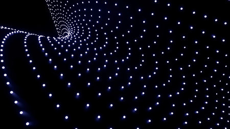 Black background.Design.Bright blue roundels that glow with white lights and lines move in one direction in the animation.の写真素材