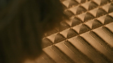 Close-up of machine cutting patterns on wood. Creative. Cutting machine runs on wooden board. Automated Wood Carving Machineの写真素材