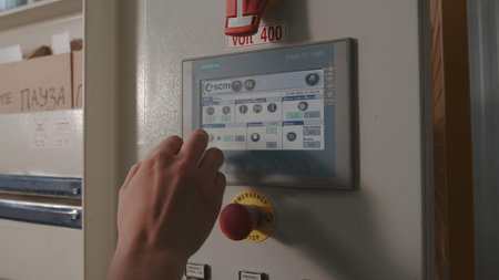 Close-up of worker clicking on industrial panel with buttons. Creative. Modern control panel for...