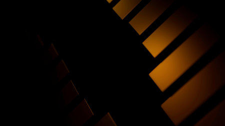 Black background with orange and pink lines. Design. Slowly closing lines of orange and pink shades made in computer graphics.の写真素材