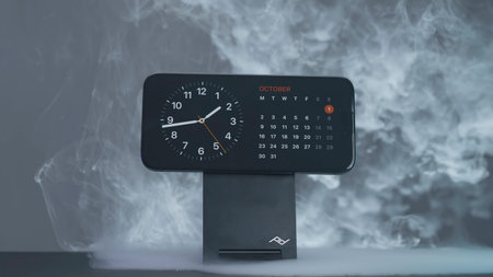 USA, New York - September 15, 2023: Clock on iPhone 15 Pro screen. Action. Stylish phone screensaver...