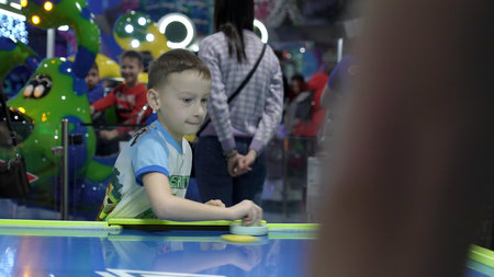 Serbia, Belgrade - Jule 18, 2023: Childrens entertainment. Clip. Small children playing in an amusement park with various attractions and vending machines.のeditorial素材