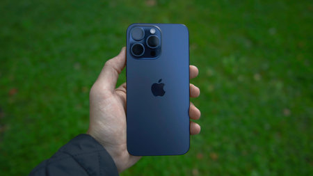 China, Beijing - September 15, 2023: New iPhone model 15 pro. Action. Hand holds new model of...