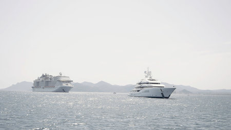 Passage of a large cruise ship in the sea. Action. Beautiful seascape on a summer day.の写真素材