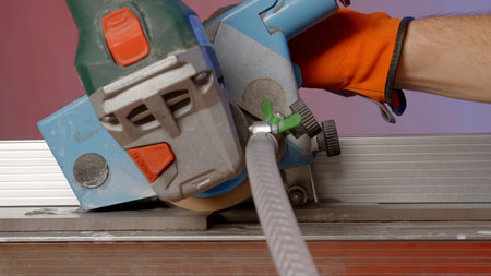 Sawing boards and smoothing surfaces. Creative. Repair work with special workers in glove with equipment.の写真素材