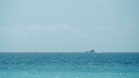 Beautiful calm sea and blue cloudy sky. Action. Amazing horizon and the endless sea water.の写真素材