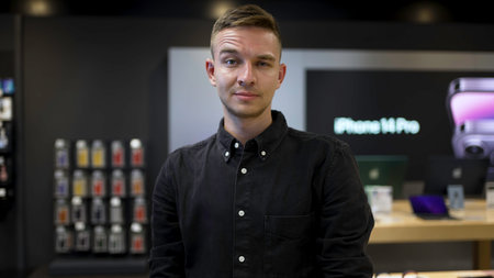 Portrait of young man with raised eyebrow. Action. Expression of young mans face with raised eyebrow. Young man with facial expression in workplaceの写真素材