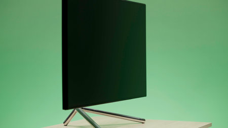 Large plasma TV. Action. A blue background with a changing color with a new generation TV that is shot from all angles.の写真素材