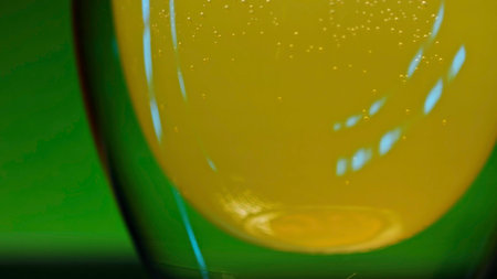 Refreshing colorful drink in a transparent glass. Stock clip. Prepared juciy cocktail at the night club party.の写真素材