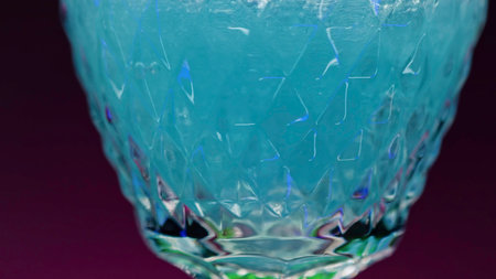 Refreshing colorful drink in a transparent glass. Stock clip. Prepared juciy cocktail at the night club party.の写真素材