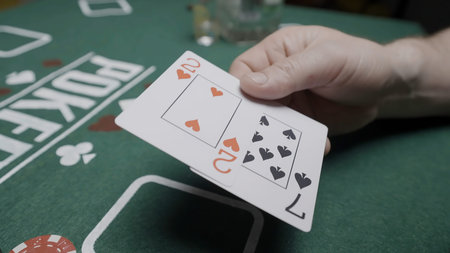 Poker players at a green table with chips and cards. Action. Concept of risk and excitement, playing...
