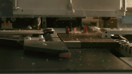 Close-up of automated drilling machine on wood. Creative. Automated machine for production of wood products processing. Drilling machine for holes in wooden boards.の写真素材