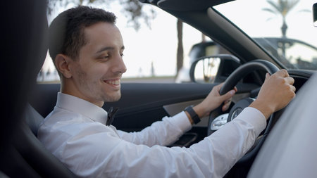 Date by car. Action. A young man at the wheel drives his wife in a car.
